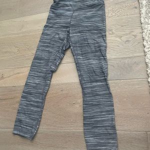 Grey and White heathered pattern lightly worn. Have a crossover